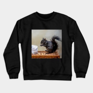 Black squirrel enjoys a bag of peanuts Crewneck Sweatshirt